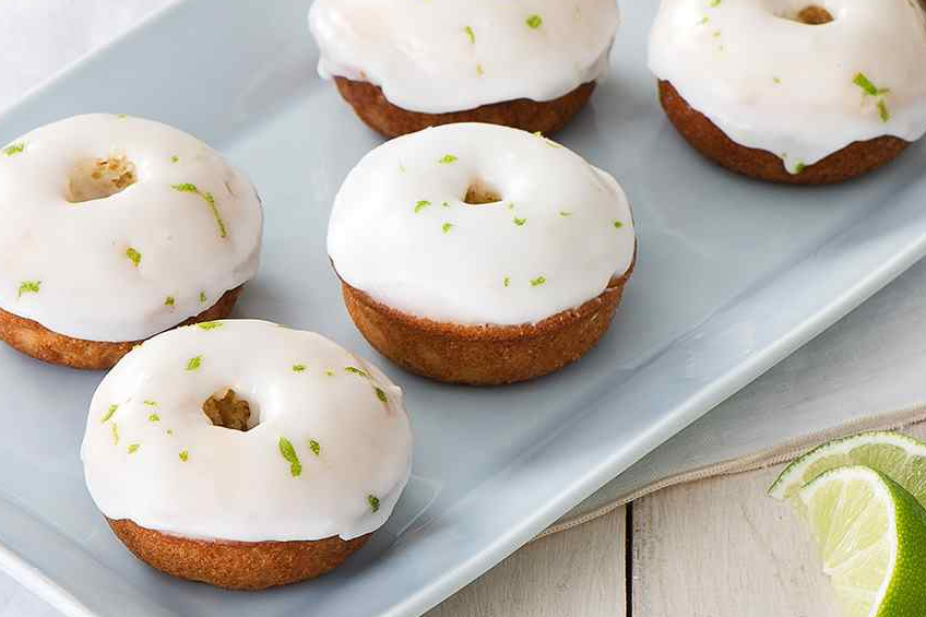 Sour cream glazed baked doughnuts with lime zest