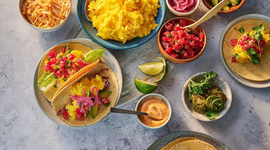 Breakfast taco spread arranged on a table