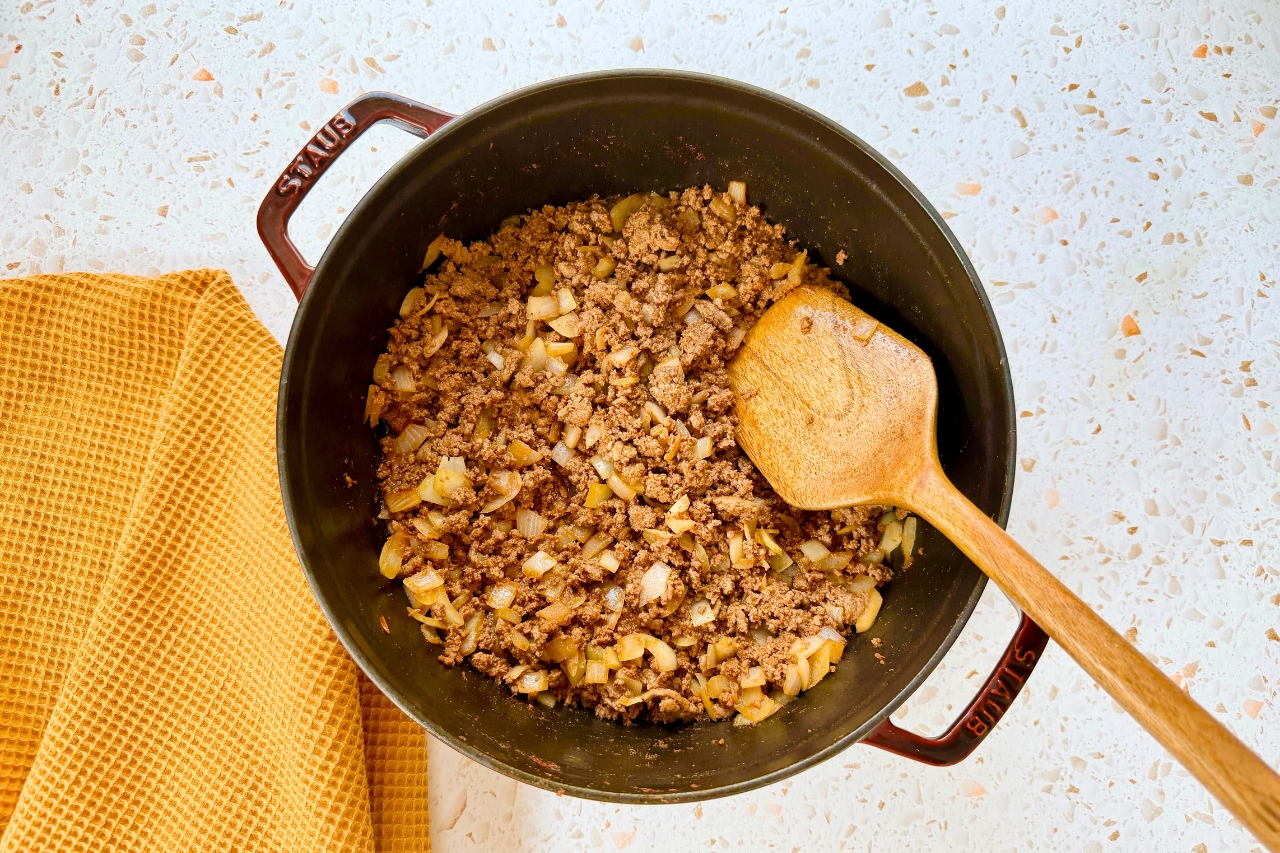 Cooked ground beef, onions and seasonings cooked in a Dutch oven